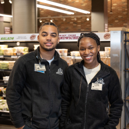 In this image, there is a picture of employee woman and man together.